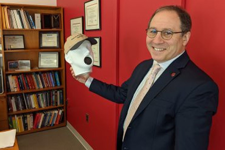 Dean Andrew Singer of the College of Engineering and Applied Sciences with a talking head.